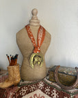 Horsehead in Horseshie with Orange Scarf