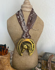 Horsehead in Horseshoe with Brown Scarf