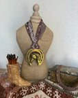 Horsehead in Horseshoe with Brown Scarf