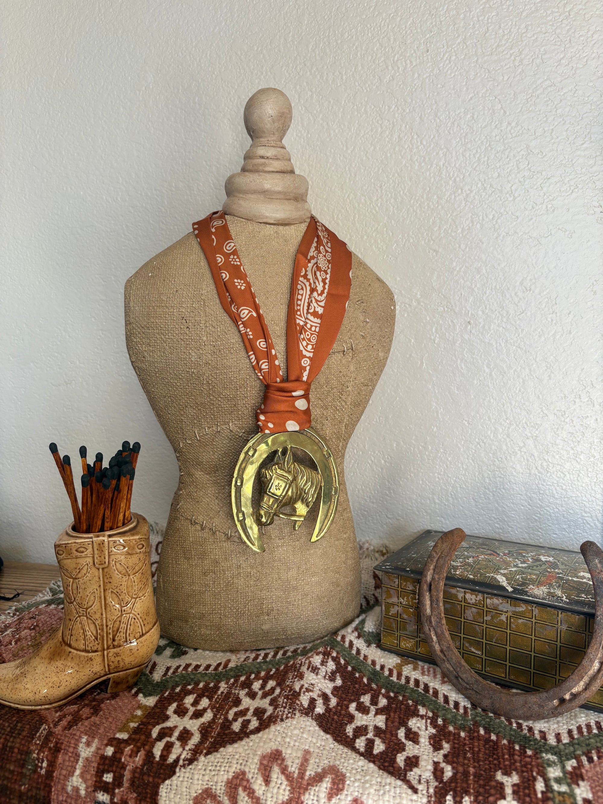 Horsehead in Horseshie with Orange Scarf